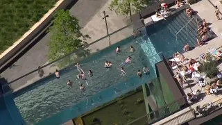 Pool Suspended Between High Rise Buildings Opens for Summer