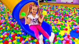 Diana and Roma have fun with Mom on the Playground