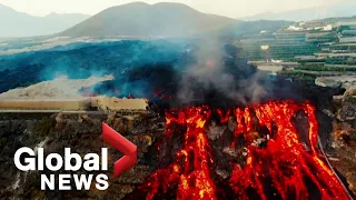 La Palma volcano: Drone video shows "lava lakes" flowing as earthquakes rattle island
