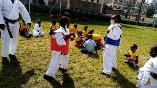 Tomylee -  Kenya Karate Coach training kids at Josnah primary school