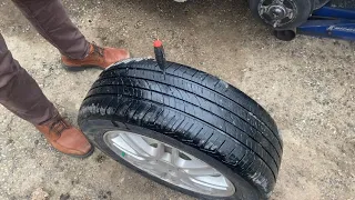 How to plug a car tire…in a suit.