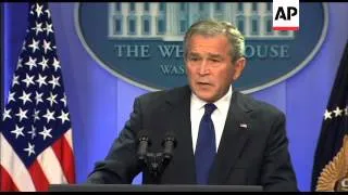 President George W. Bush responds to reporters questions regarding President Putin and President Ahm