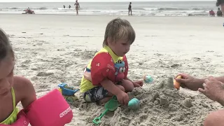 Building sand castles at the beach with daddy