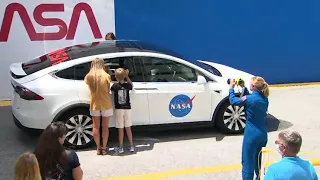 NASA astronauts Bob Behnken and Doug Hurley enter the TESLA X