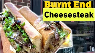 INSANE Burnt End Brisket Cheesesteak smothered in rosemary cheese sauce fitted in a Sarcone roll!