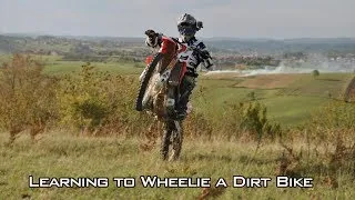 Learning to Wheelie a Dirt Bike