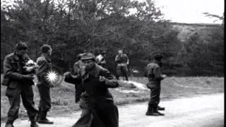 Liberated American POWs kick, hit and throw things at newly captured German priso...HD Stock Footage