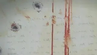 Jurors see Tsarnaev note written inside hideout boat
