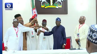 ‘I’m With You,’ Tinubu Presents APC Flag To Edo Gov Candidate Okpebholo