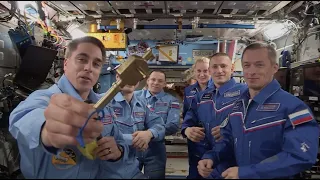 NASA's Chris Cassidy gives space station 'key' to Russia's Sergey Ryzhikov