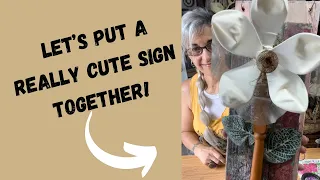 Putting a really cute sign!