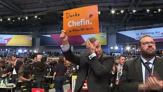 Tearful CDU members give Merkel standing ovation