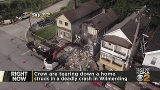 Crews tear down vacant home after deadly garbage truck crash