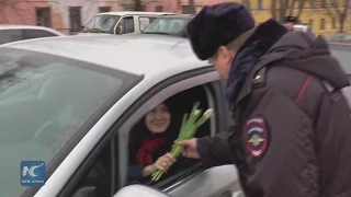 Women drivers get flowers from police in central Russia