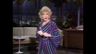 Joan Rivers monologue purple striped dress