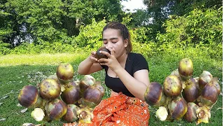 Eating palm fruit in the forest /Nature life style in countryside!