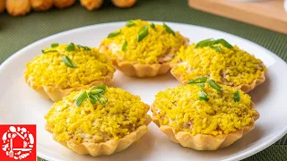 Tartlets with cod liver on the festive table