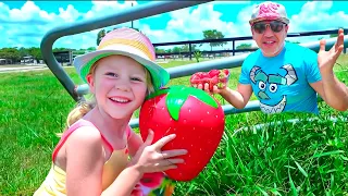 Nastya and dad feed farm animals and collect fruits and vegetables