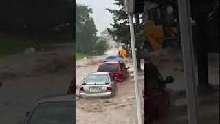 Car washes down the street during intense flooding in Reading, Pennsylvania