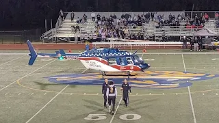 Air Evac Lifeteam delivers home coming game ball to the seckman highschool field.