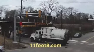 Industrial vacuum truck smashes into the 11foot8 bridge