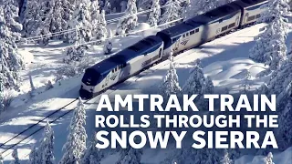 Amtrak Train Crawls through the Snowy Sierra Mountains in California
