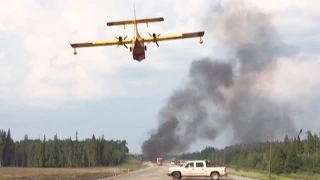 Caught on Cam: Water bomber tackles Manitoba highway blaze