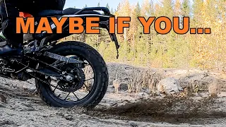 KTM 390 Adventure with standard tires try to drive up a steep sand slope