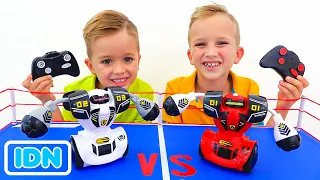 Vlad dan Niki bermain dengan mobil mainan RC & robot