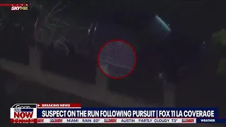 Helicopter catches suspect hiding under truck from Los Angeles police after chase | LiveNOW from FOX