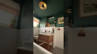 The coziest dark green bathroom