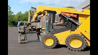 Moving a Bridgeport mill and a SouthBend 13" lathe with skid steers