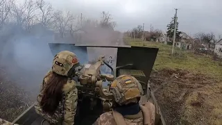 IMPRESSIVE: Ukrainian service woman operating a ZU-23-2.