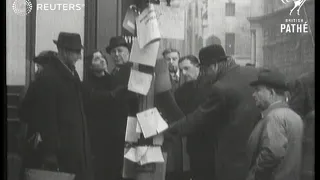 Air raid damage in London is devastating but business moves on and people go about clean up (1941)