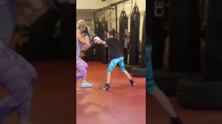 Ivy Enriquez doing mitts with Holly Holm