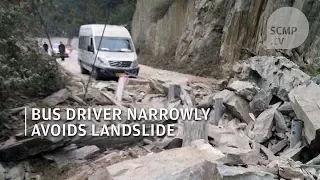 Chinese bus driver becomes 'a hero' after narrowly avoiding landslide