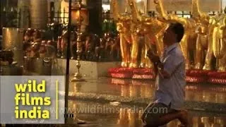 People praying and paying obeisance at the Erawan shrine - Bangkok