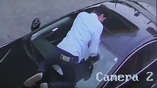 Exclusive: Surveillance video shows driver jumping on car to stop thieves from stealing it