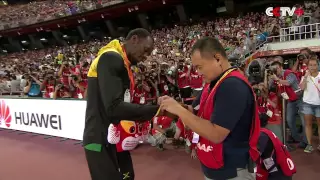 Usain Bolt Receives Gift from Cameraman Who Crashed into Him