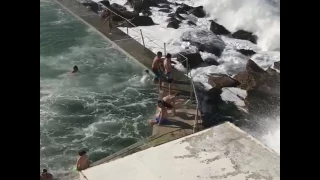 Giant Waves Pushes Several People into Pool