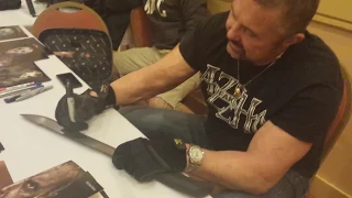 Kane Hodder signing machetes for Leasure Trading Co. at Monster Mania 2014