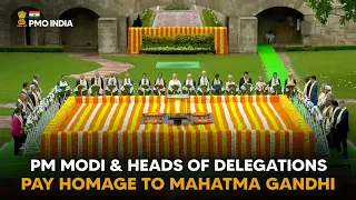 PM Modi & Heads of Delegations at Rajghat to pay homage to Mahatma Gandhi