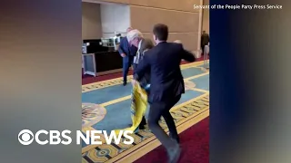 Fistfight erupts when Russian diplomat rips down Ukrainian flag at conference