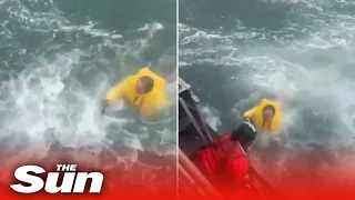 Dramatic rescue of four people in rough seas as Hurricane Ian batters North Carolina