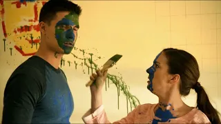 Robbie Amell covered in paint