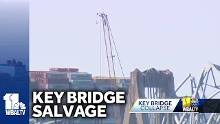 Cranes removing wreckage of Key Bridge; 4 unaccounted for