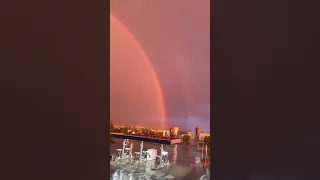 Double Rainbow Shines in the Sky During Thunderstorm