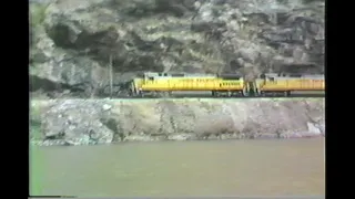 1055.  4  UNION PACIFIC UP 9107 pacing stack train in the feather river canyon from across river in