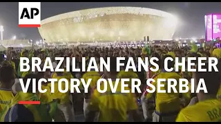 Brazilian fans cheer victory over Serbia at World Cup