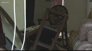 Woman narrowly escapes after car crashes into her apartment